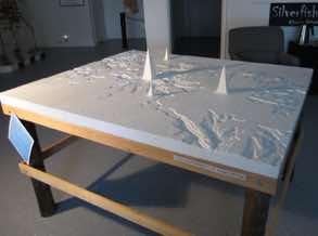 2003. Mixed-media. 48"H x 57"W x 8"D.<br/>Based on an aquifer topo map I drew the USGS.<br/>The tallest point represents the city of Rochester, MN.
